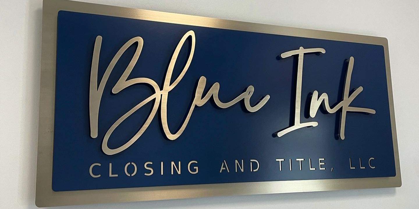Custom metal sign featuring a layered logo.