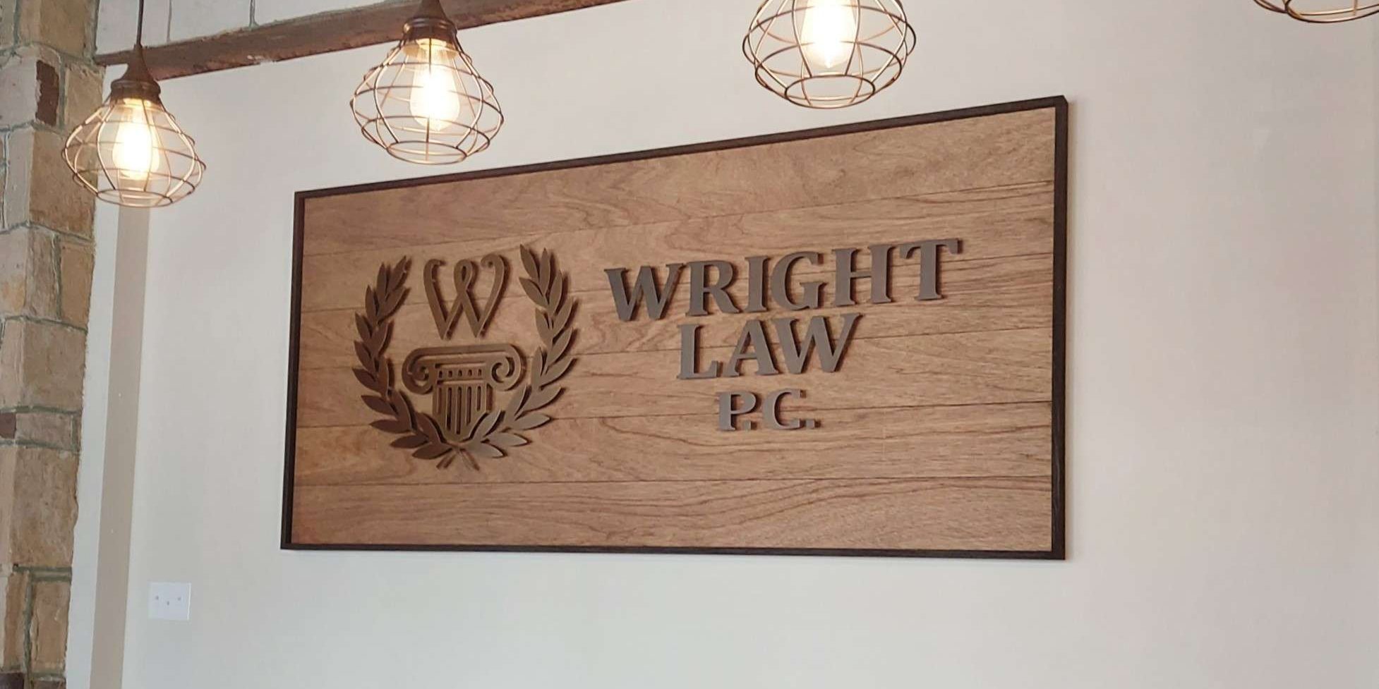 Custom metal logo sign on wood.