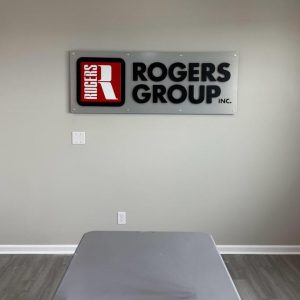 Custom metal sign with raised single letters mounted on a backplate by Alabama Metal Art.