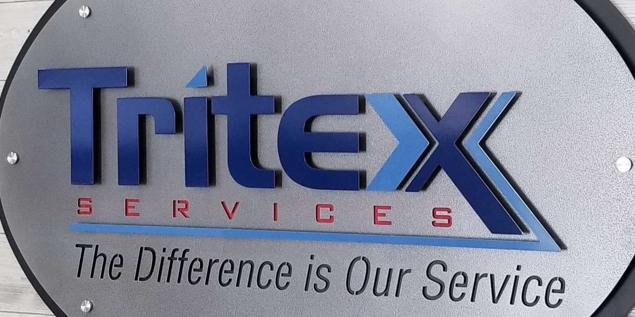 Custom metal sign shown with layers and stenciled letters.
