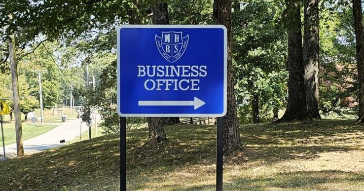 Custom metal directional sign for Mars Hill Bible School in Florence, Alabama.