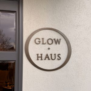 Custom metal building sign for Glow Haus in Montgomery, AL by Alabama Metal Art.