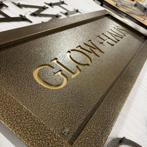 Close up of custom metal yard sign for Glow Haus in Montgomery, AL by Alabama Metal Art.