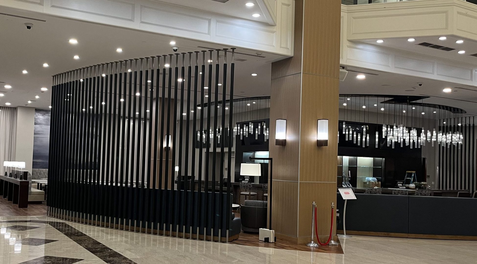 Custom metal divider for Hyatt hotel lobby and bar by Alabama Metal Art.