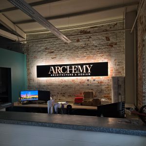 Custom backlit lobby sign for Archemy in Huntsville, AL by Alabama Metal Art.