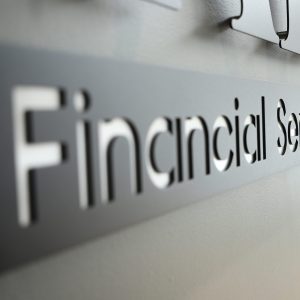 Close up of custom metal logo sign for FAB Financial Services lobby wall by Alabama Metal Art.