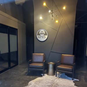 Custom metal stencil cut lobby sign for Spry Law Firm in Florence, AL by Alabama Metal Art.