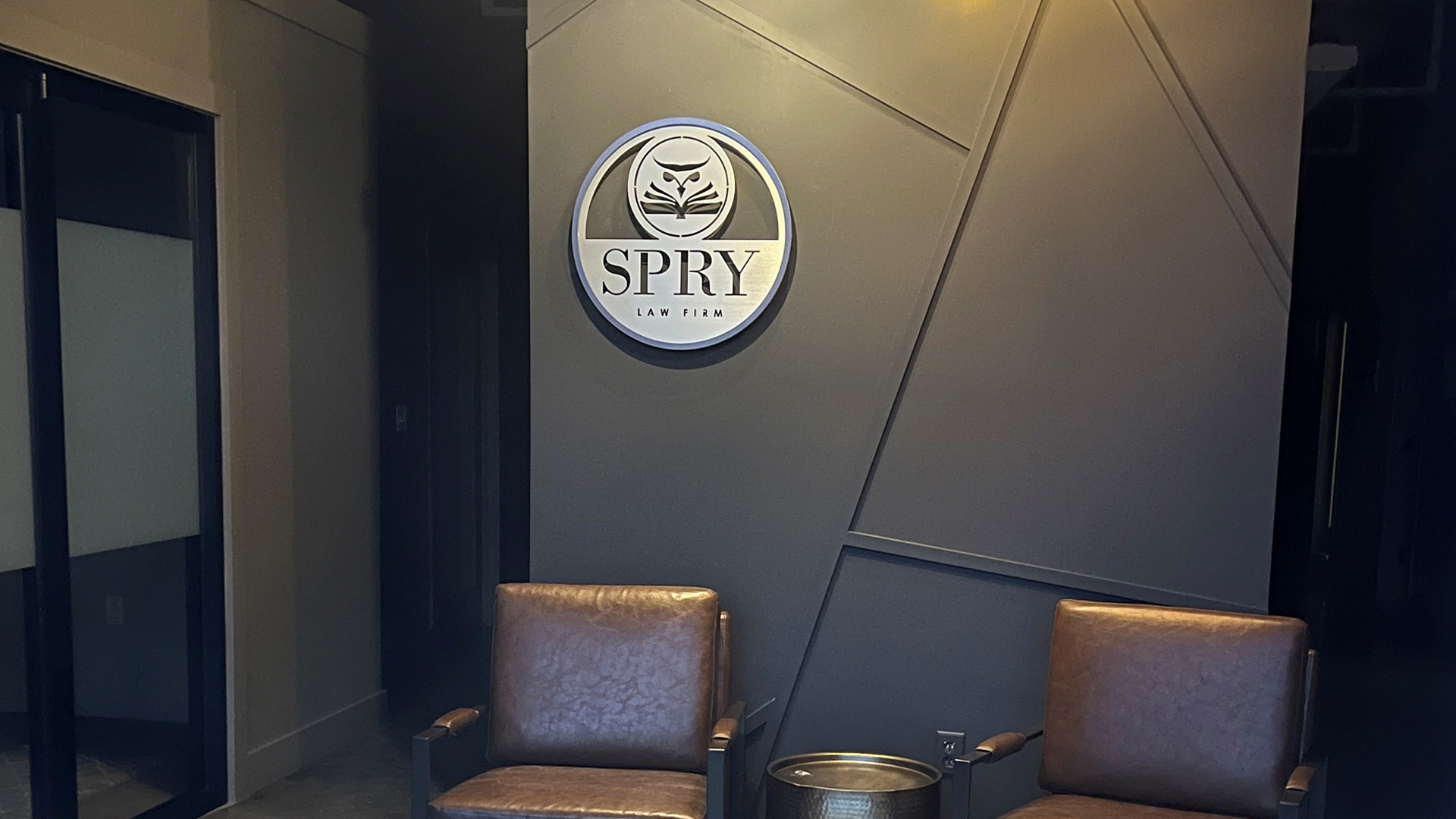 Custom metal stainless steel stencil cut sign for Spry Law Firm by Alabama Metal Art.