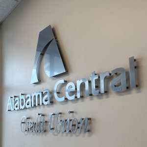 Dimensional metal logo sign for Alabama Central Credit Union with standoff wall mount